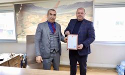 Menderes Belediyesi’nden tarihi satın alma: Ziraat Bankası iş yerinin tapusu alındı